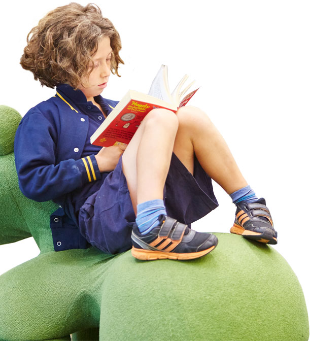 Boy reading in a Glen Eira library